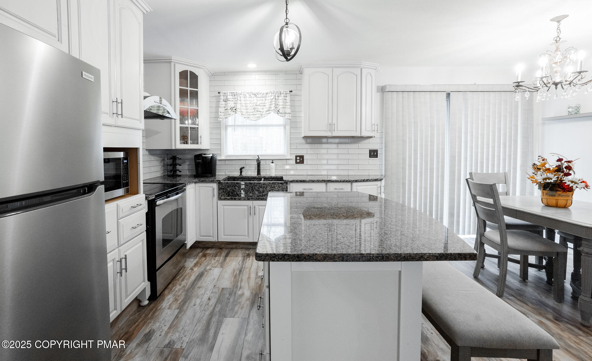 3118 Ogontz Drive Pocono Lake, PA 18347 - Photo 18 of 66 a kitchen with white cabinets and stainless steel appliances