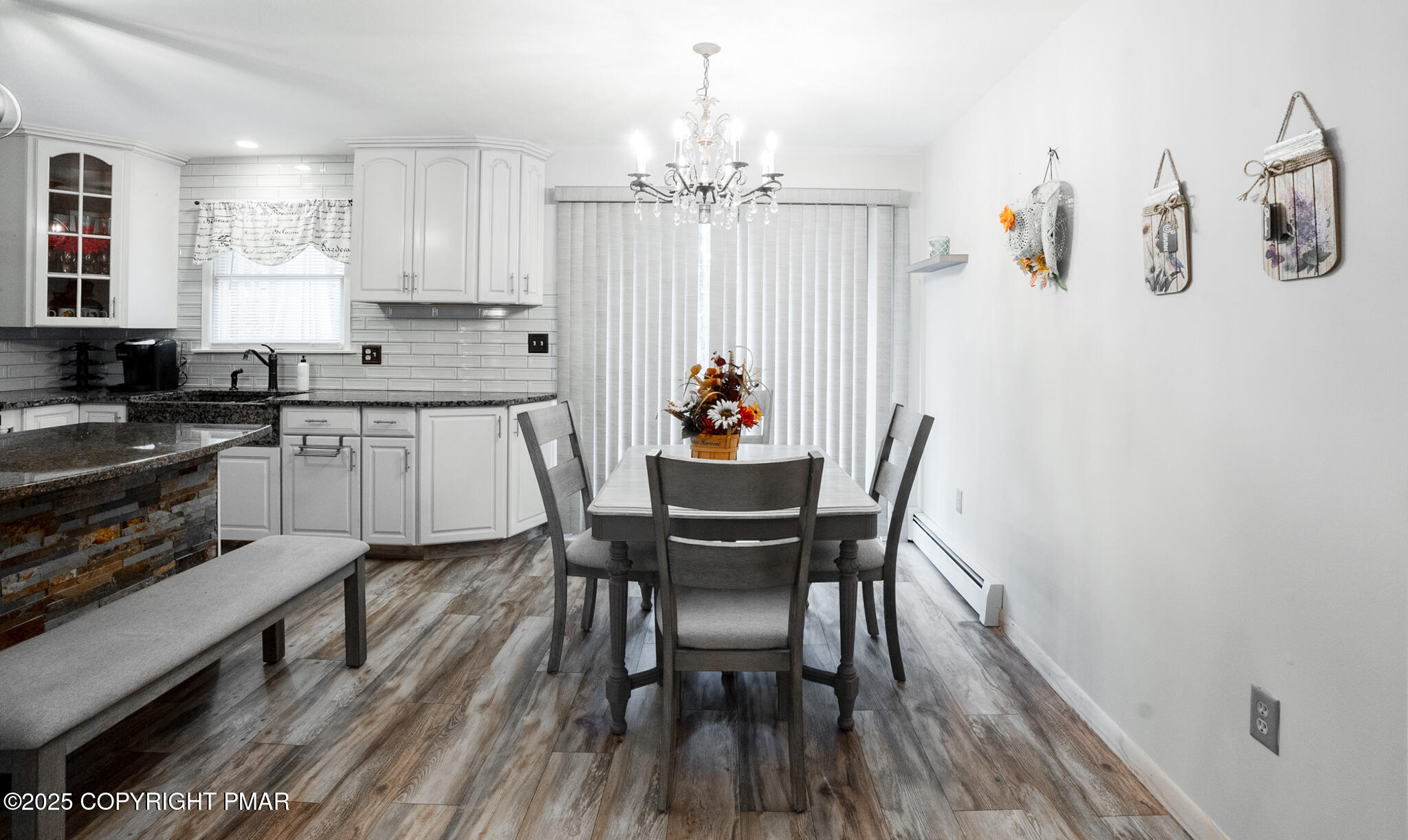 3118 Ogontz Drive Pocono Lake, PA 18347 - Photo 22 of 66 a dining room with furniture a chandelier and wooden floor