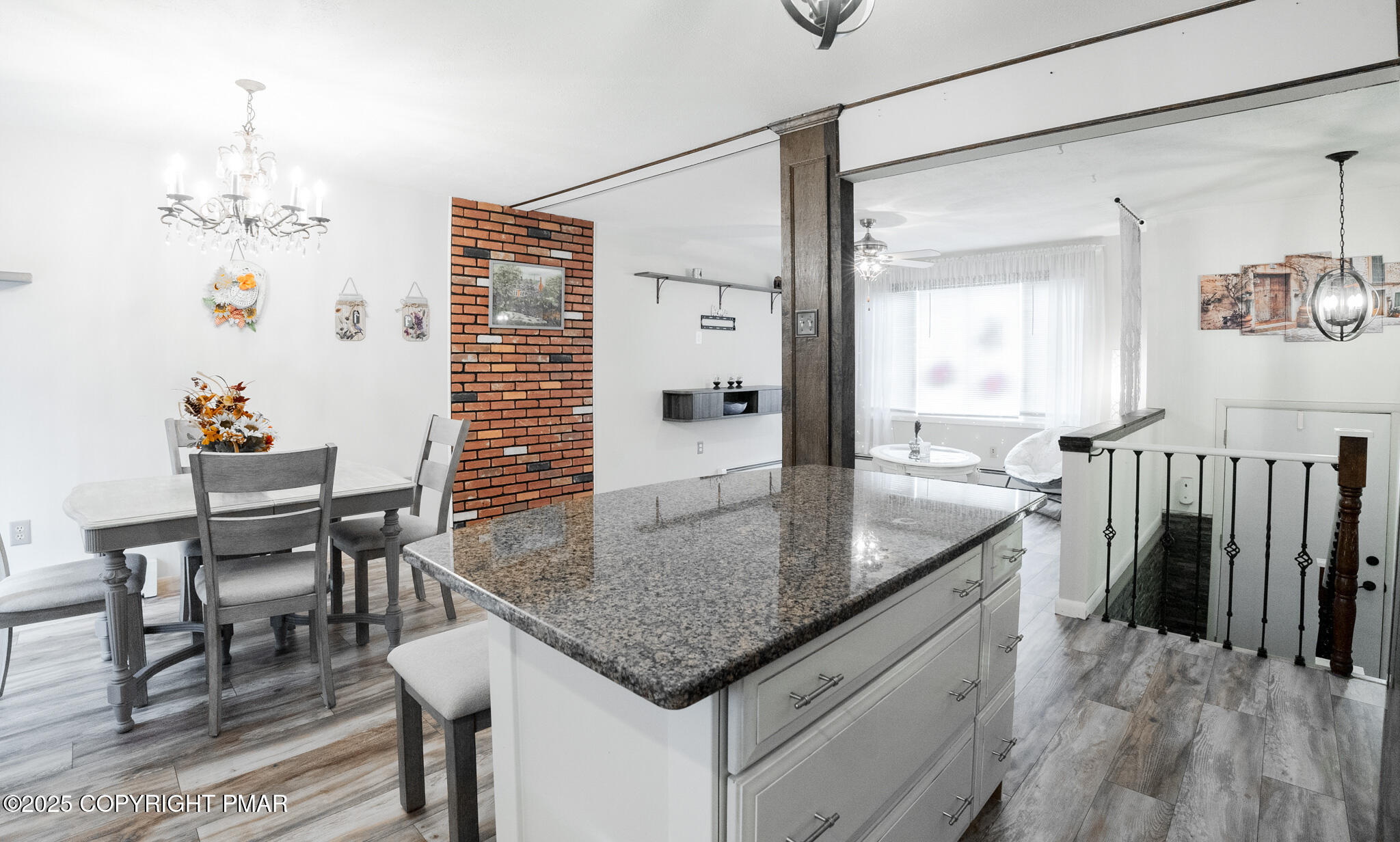 3118 Ogontz Drive Pocono Lake, PA 18347 - Photo 23 of 66 a kitchen with granite countertop a table chairs and a refrigerator