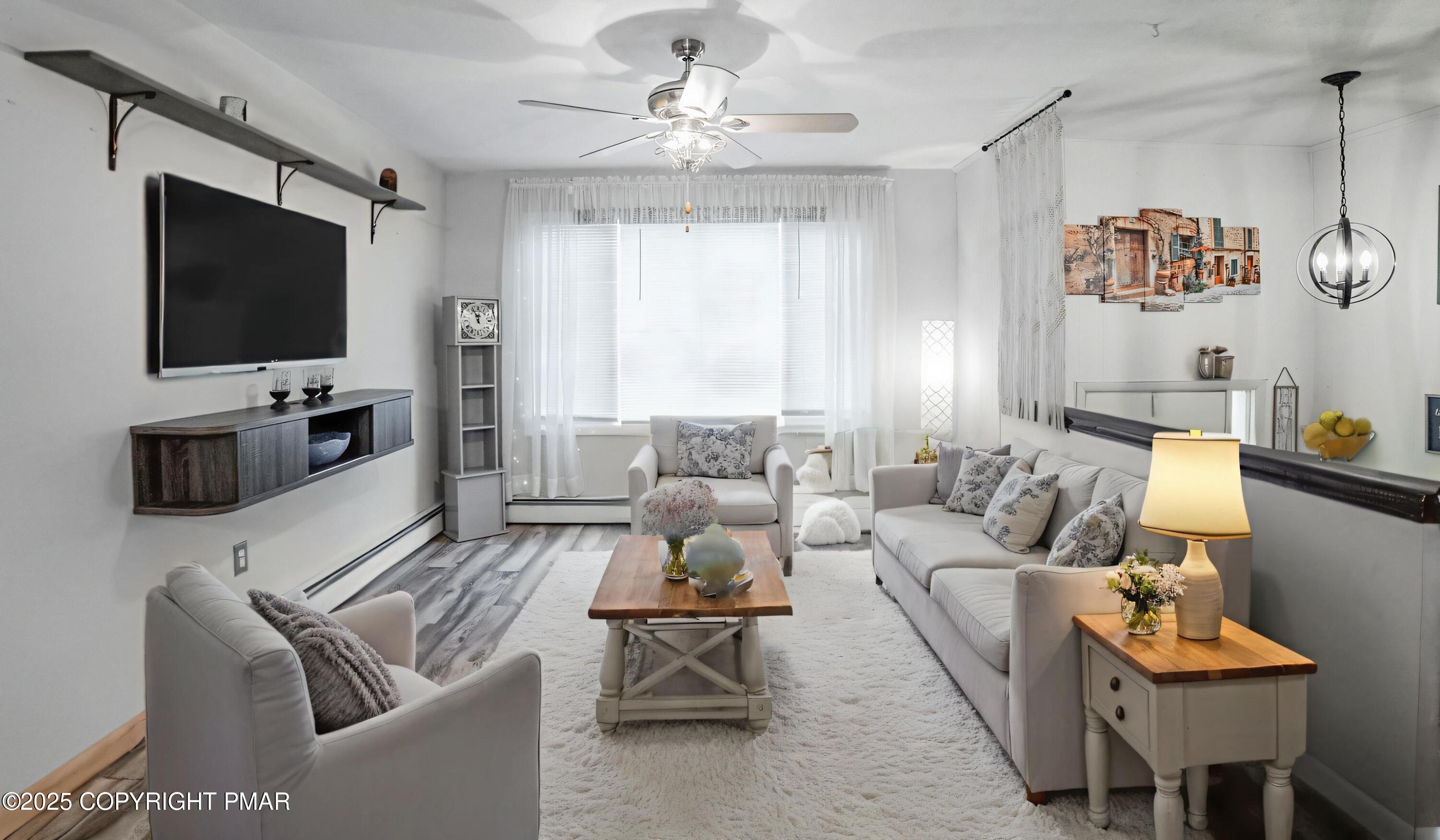 3118 Ogontz Drive Pocono Lake, PA 18347 - Photo 26 of 66 a living room with furniture a flat screen tv and a window