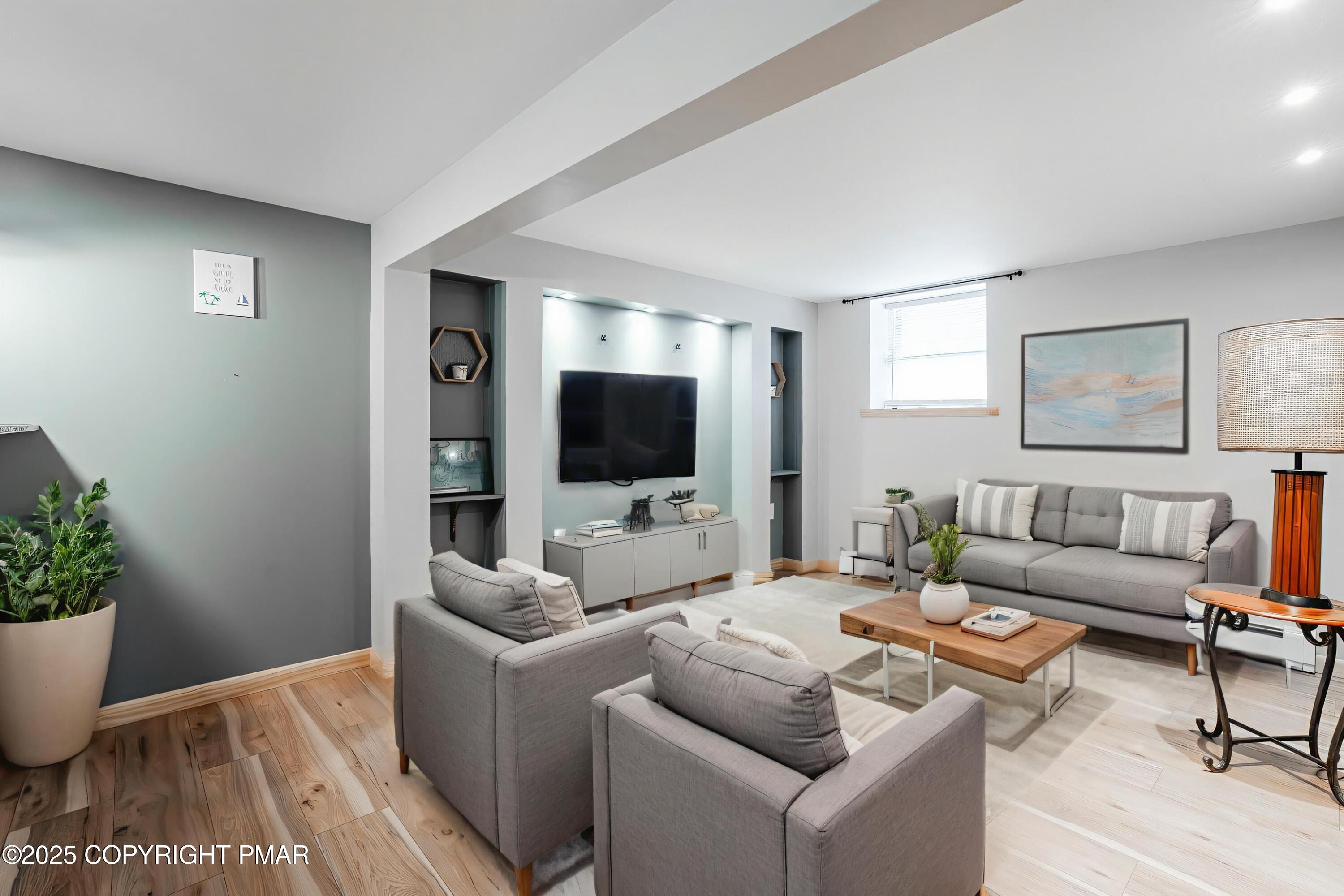 3118 Ogontz Drive Pocono Lake, PA 18347 - Photo 31 of 66 a living room with furniture and a flat screen tv