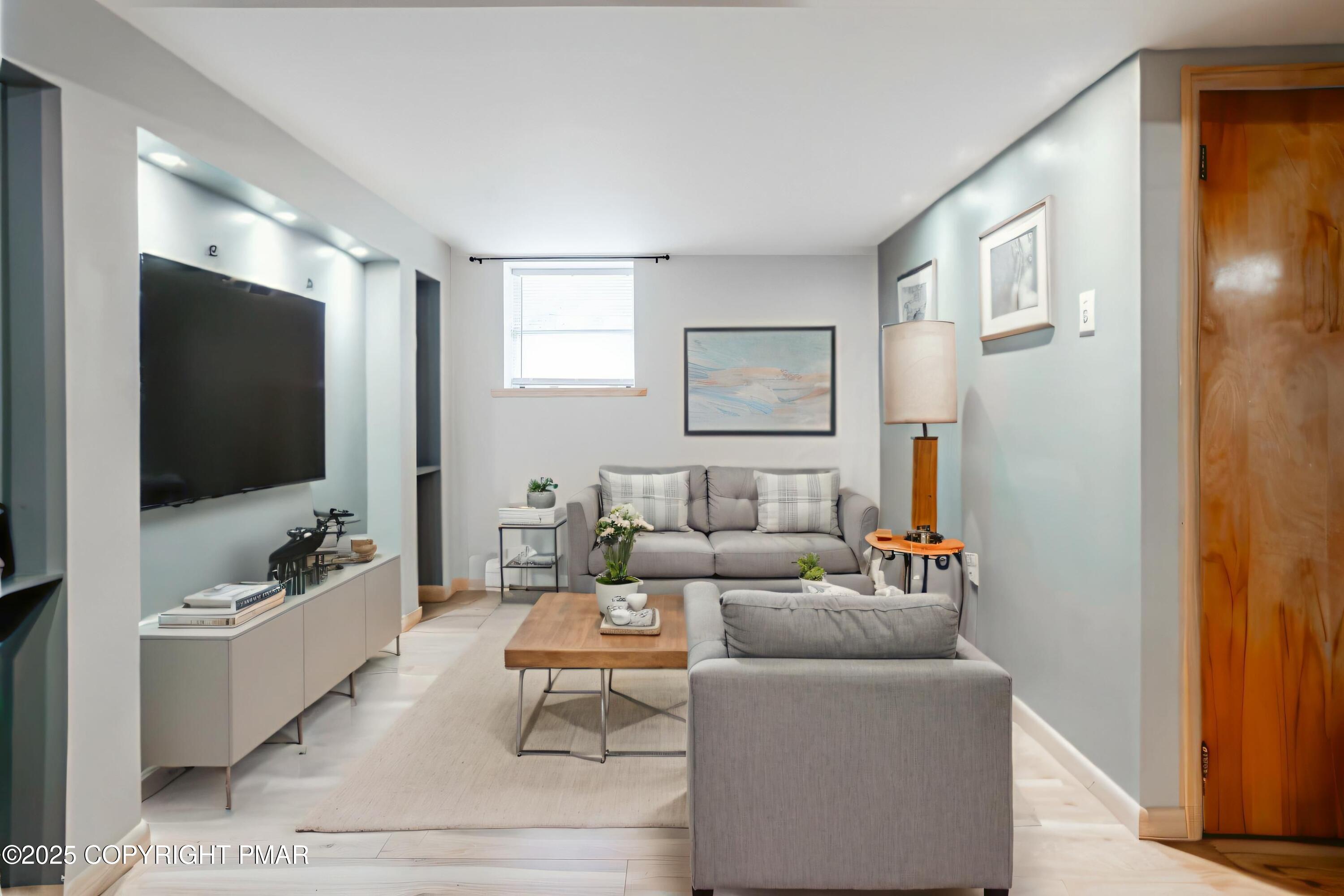 3118 Ogontz Drive Pocono Lake, PA 18347 - Photo 33 of 66 a living room with furniture and a flat screen tv