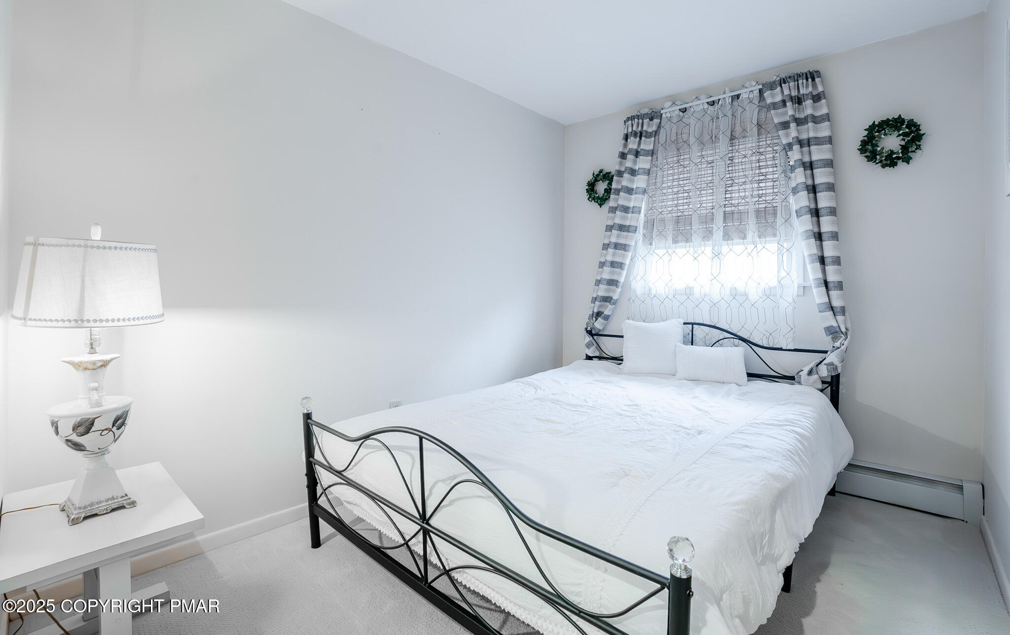 3118 Ogontz Drive Pocono Lake, PA 18347 - Photo 43 of 66 a bedroom with a bed and a table