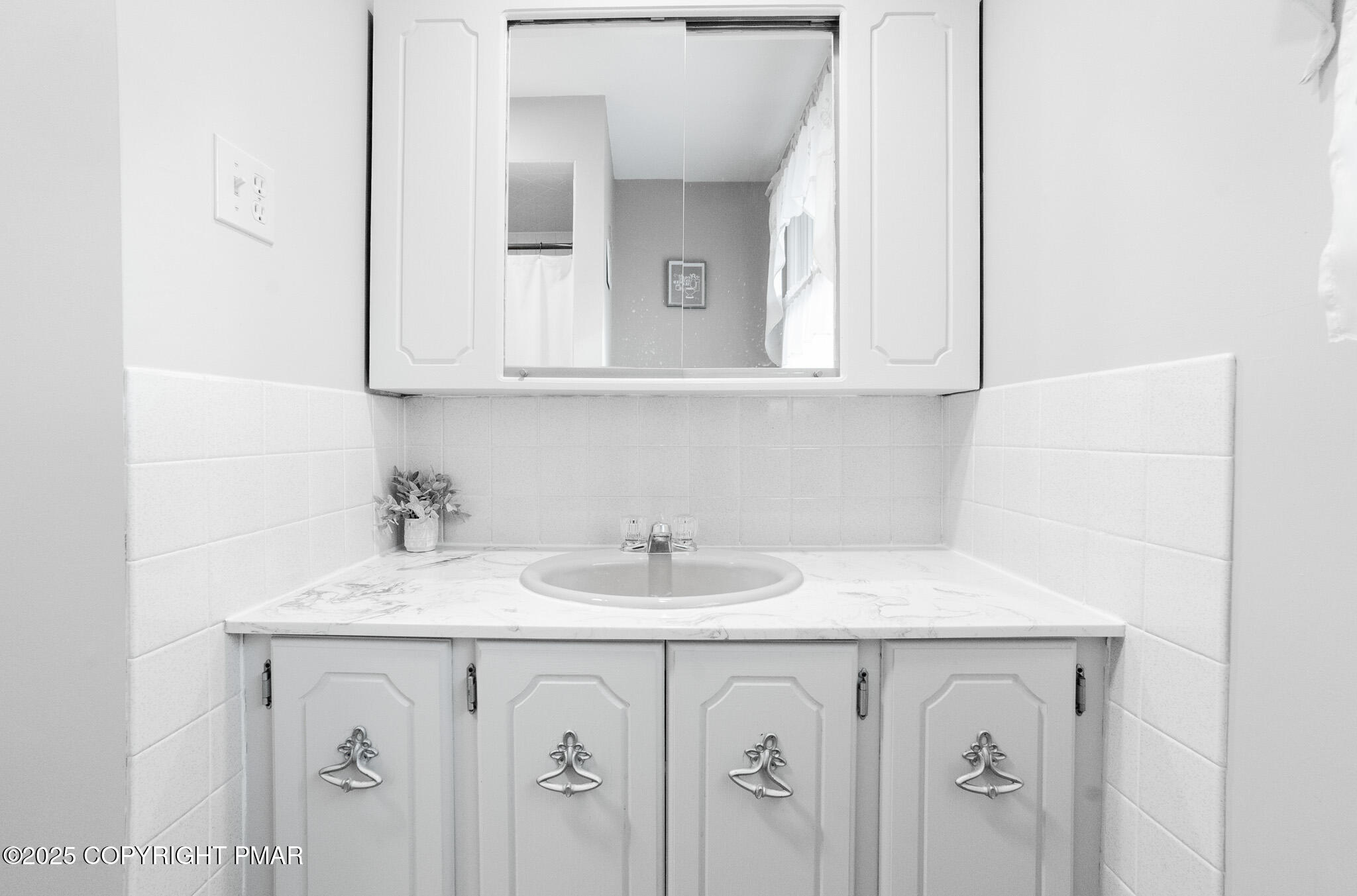 3118 Ogontz Drive Pocono Lake, PA 18347 - Photo 46 of 66 a bathroom with a sink and a mirror