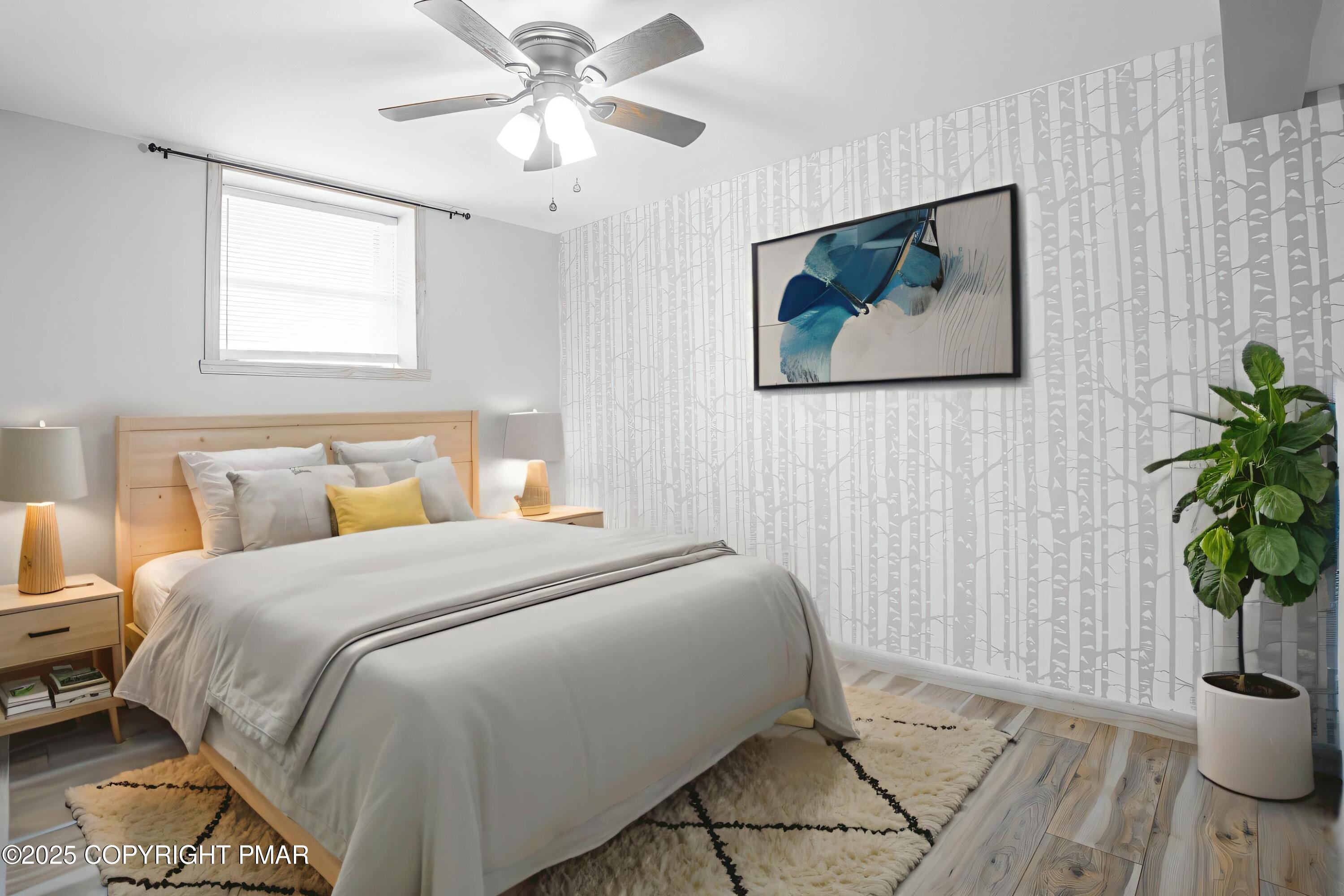 3118 Ogontz Drive Pocono Lake, PA 18347 - Photo 48 of 66 a bedroom with a bed and a potted plant