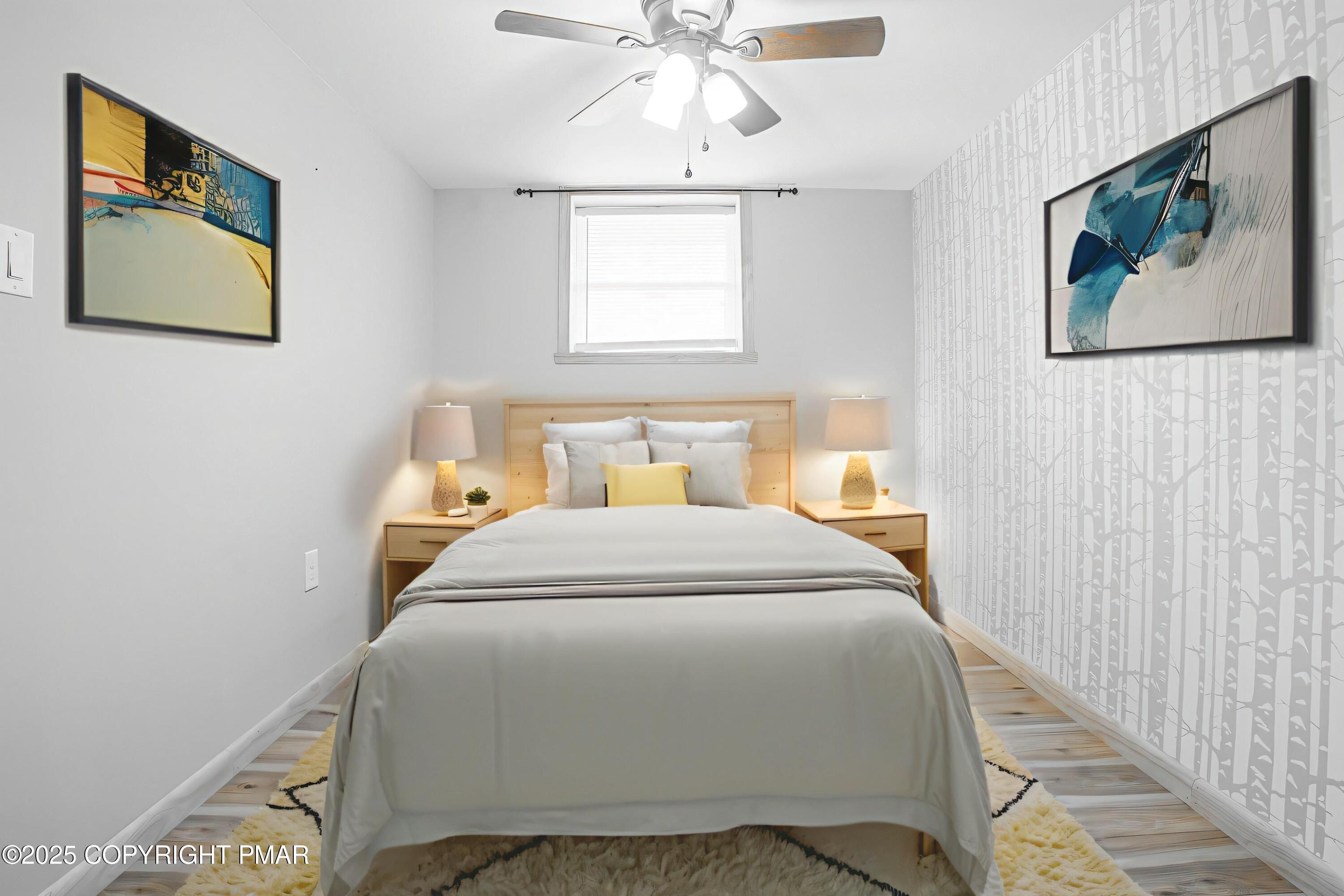 3118 Ogontz Drive Pocono Lake, PA 18347 - Photo 50 of 66 a bedroom with a bed and a chandelier