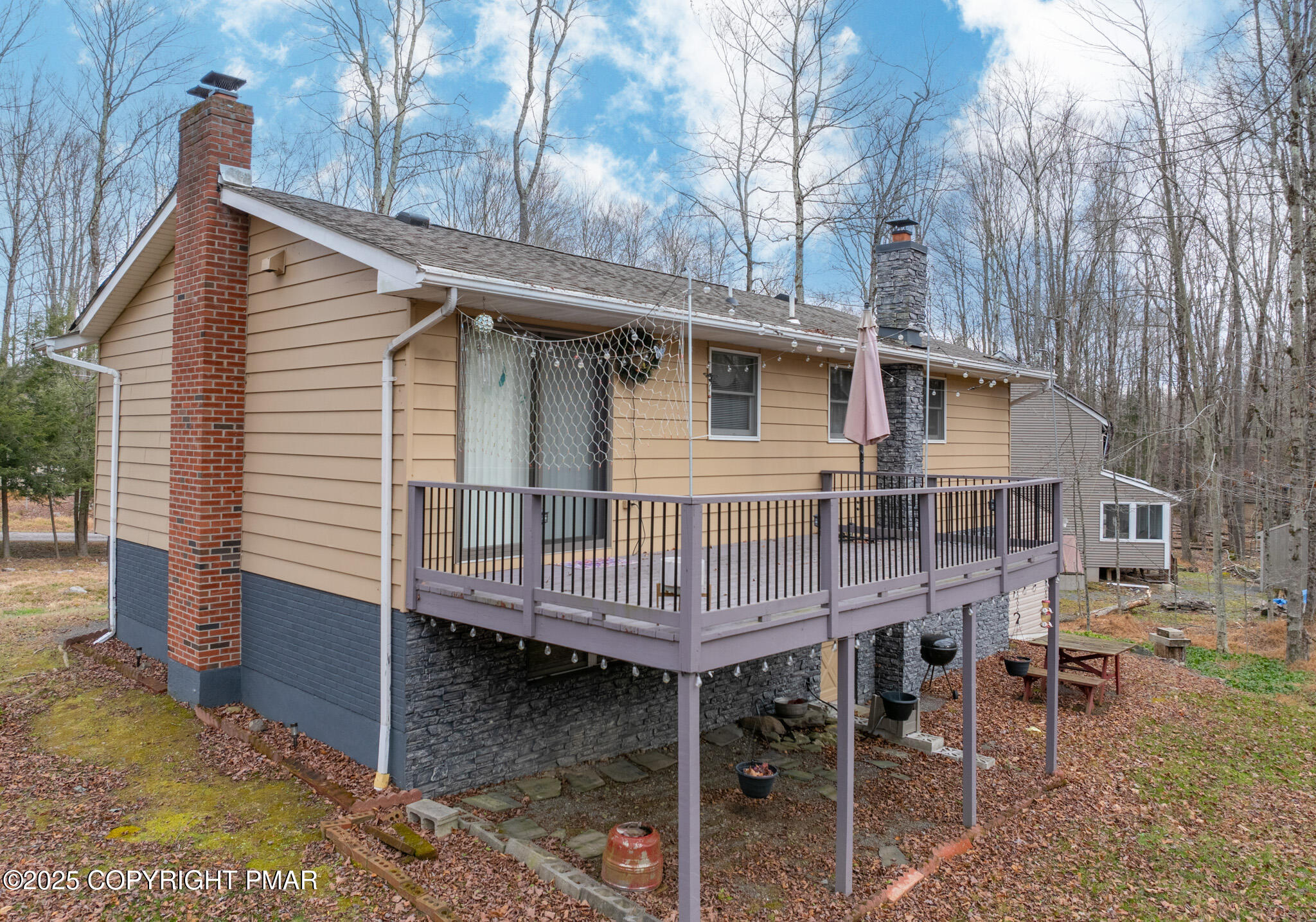 3118 Ogontz Drive Pocono Lake, PA 18347 - Photo 60 of 66 a view of a house with a patio and backyard