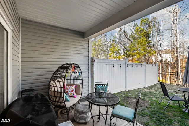 a view of a two chairs in the balcony