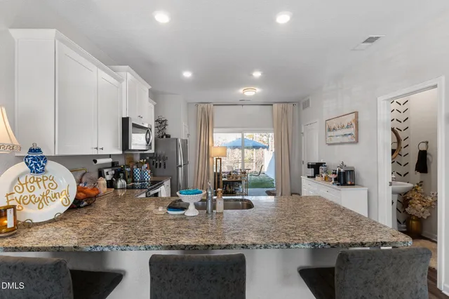 a bathroom with a sink mirror and vanity