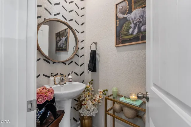 a kitchen with granite countertop a refrigerator stove and microwave
