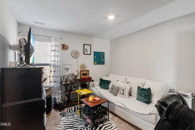 a bathroom with a sink a toilet and shower curtain