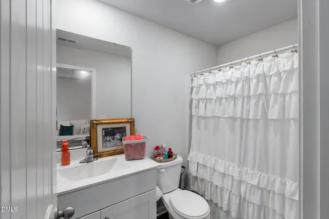 a room with a bed and furniture