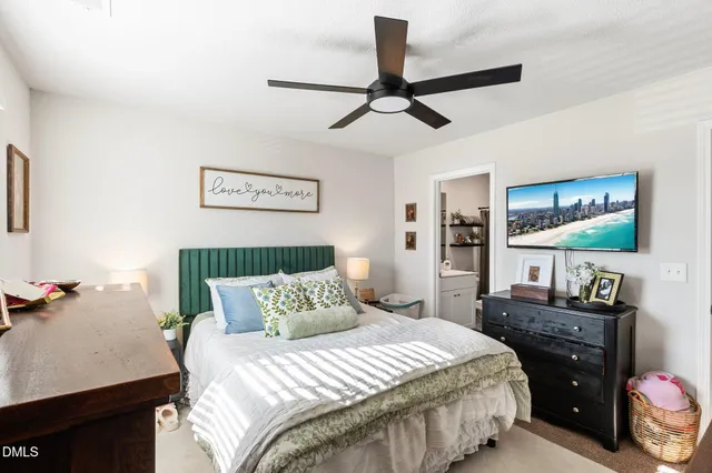a bathroom with a sink toilet and shower curtain