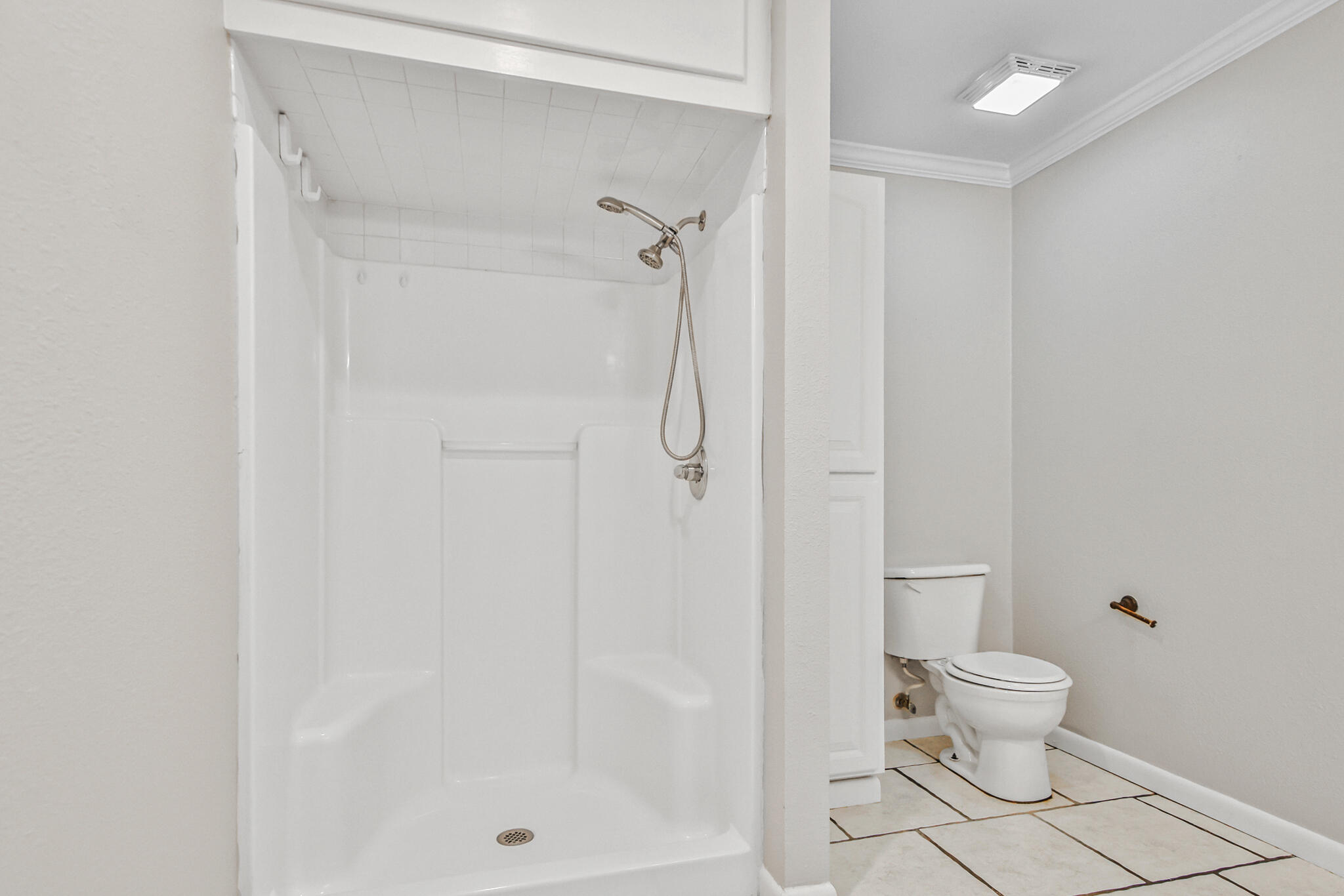 4310 42nd Street Lubbock, TX 79413 - Photo 16 of 30 a bathroom with a shower and a toilet
