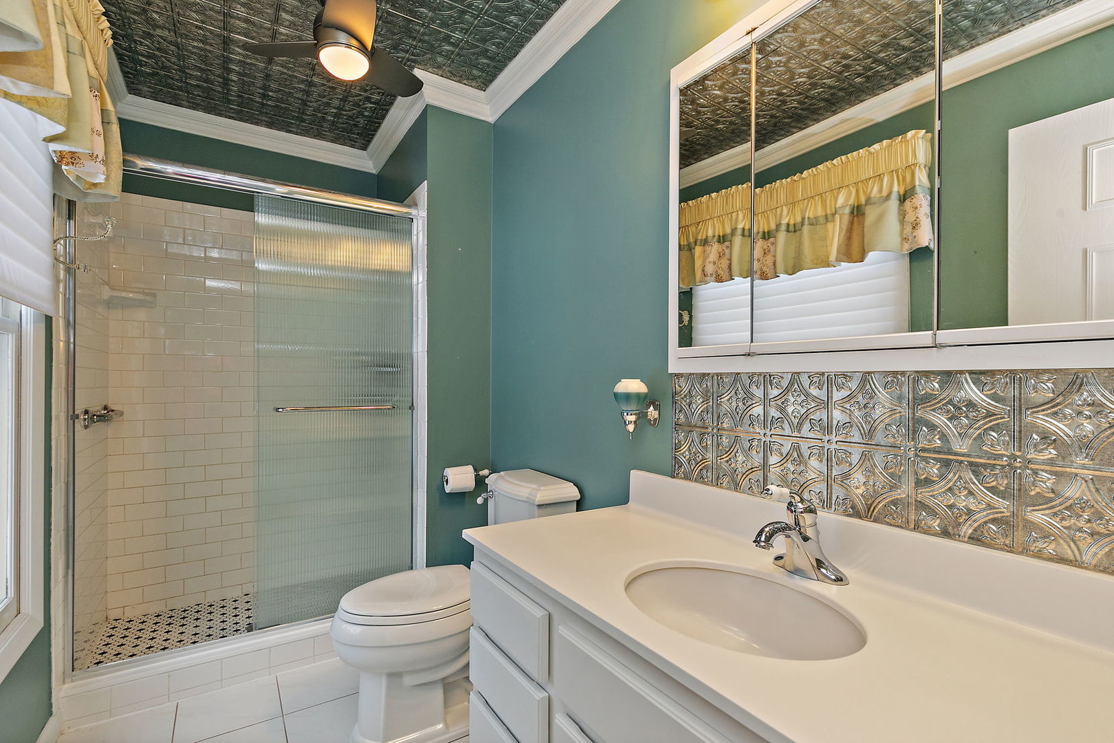 1021 Abbey Drive Crystal Lake, IL 60014 - Photo 17 of 28 a bathroom with a sink a toilet and shower