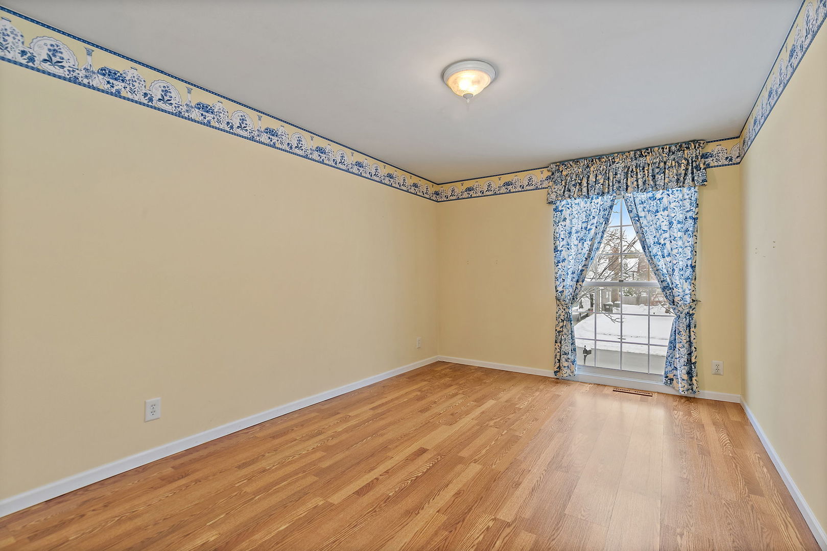 1021 Abbey Drive Crystal Lake, IL 60014 - Photo 19 of 28 a view of empty room with wooden floor and fan