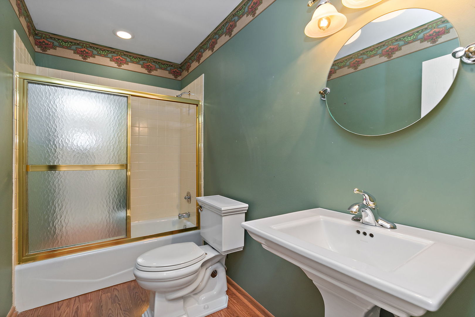 1021 Abbey Drive Crystal Lake, IL 60014 - Photo 20 of 28 a bathroom with a sink and mirror with toilet