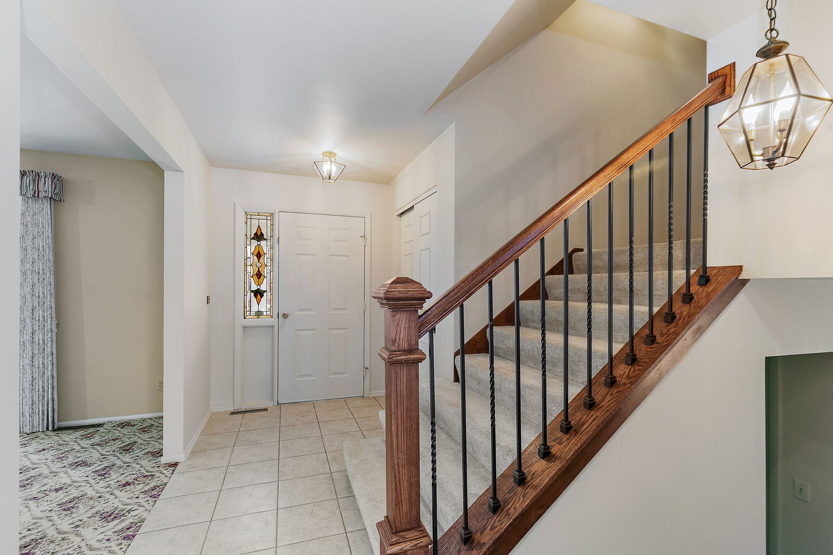 1021 Abbey Drive Crystal Lake, IL 60014 - Photo 2 of 28 a view of an entryway with staircase