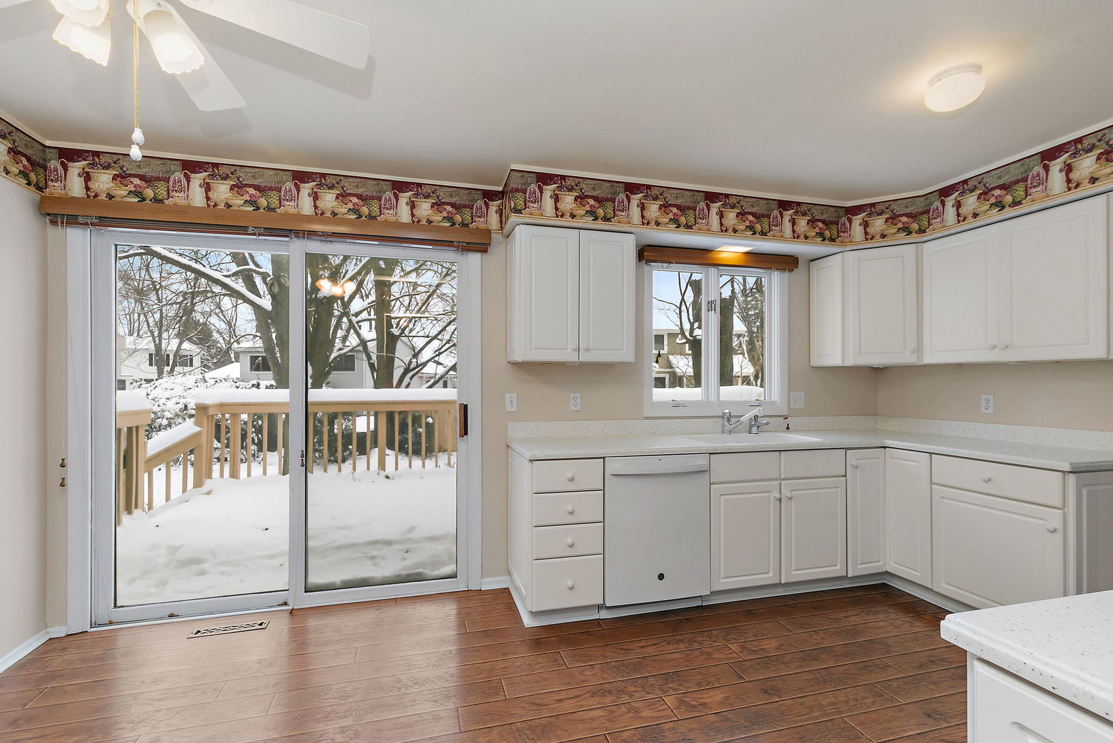1021 Abbey Drive Crystal Lake, IL 60014 - Photo 9 of 28 a kitchen with a sink window and cabinets