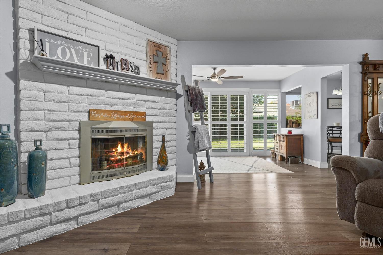 Undisclosed Address Bakersfield, CA 93309 - Photo 12 of 34 a living room with furniture and a fireplace