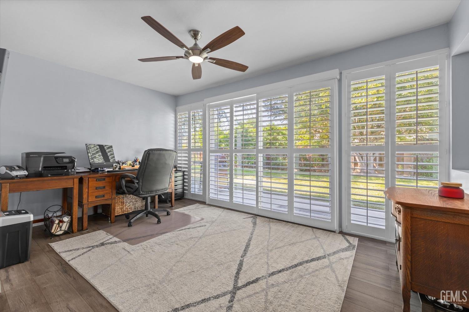 Undisclosed Address Bakersfield, CA 93309 - Photo 13 of 34 a view of a workspace with furniture and a window