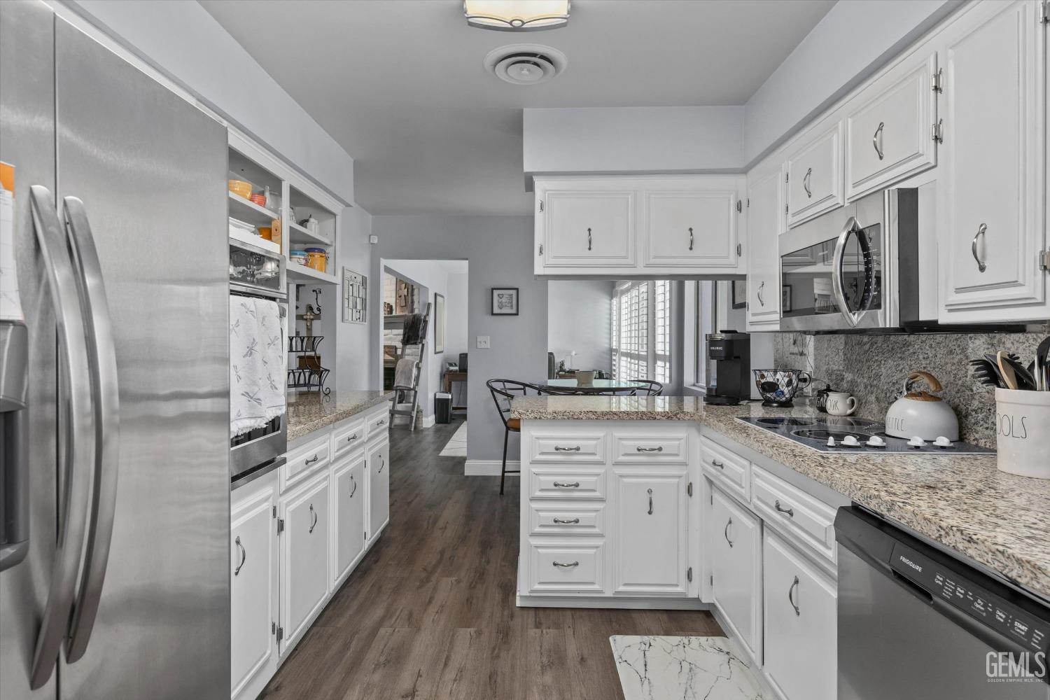 Undisclosed Address Bakersfield, CA 93309 - Photo 21 of 34 a kitchen with stainless steel appliances granite countertop a refrigerator sink and cabinets