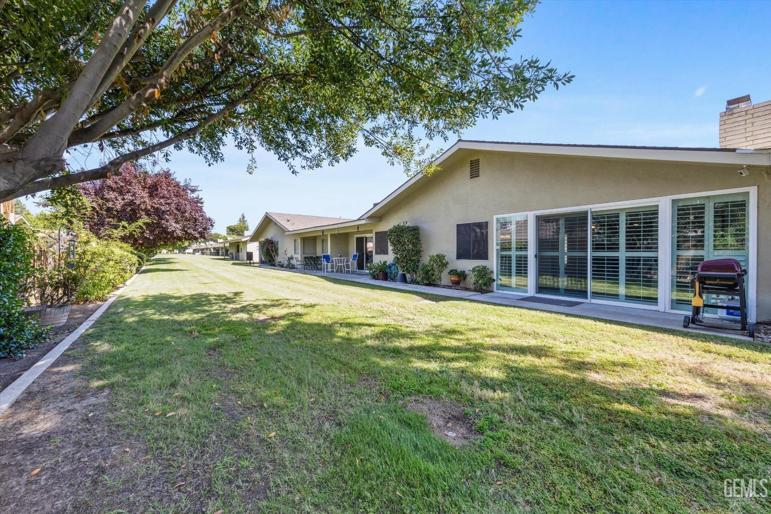 Undisclosed Address Bakersfield, CA 93309 - Photo 33 of 34 a front view of a house with a yard