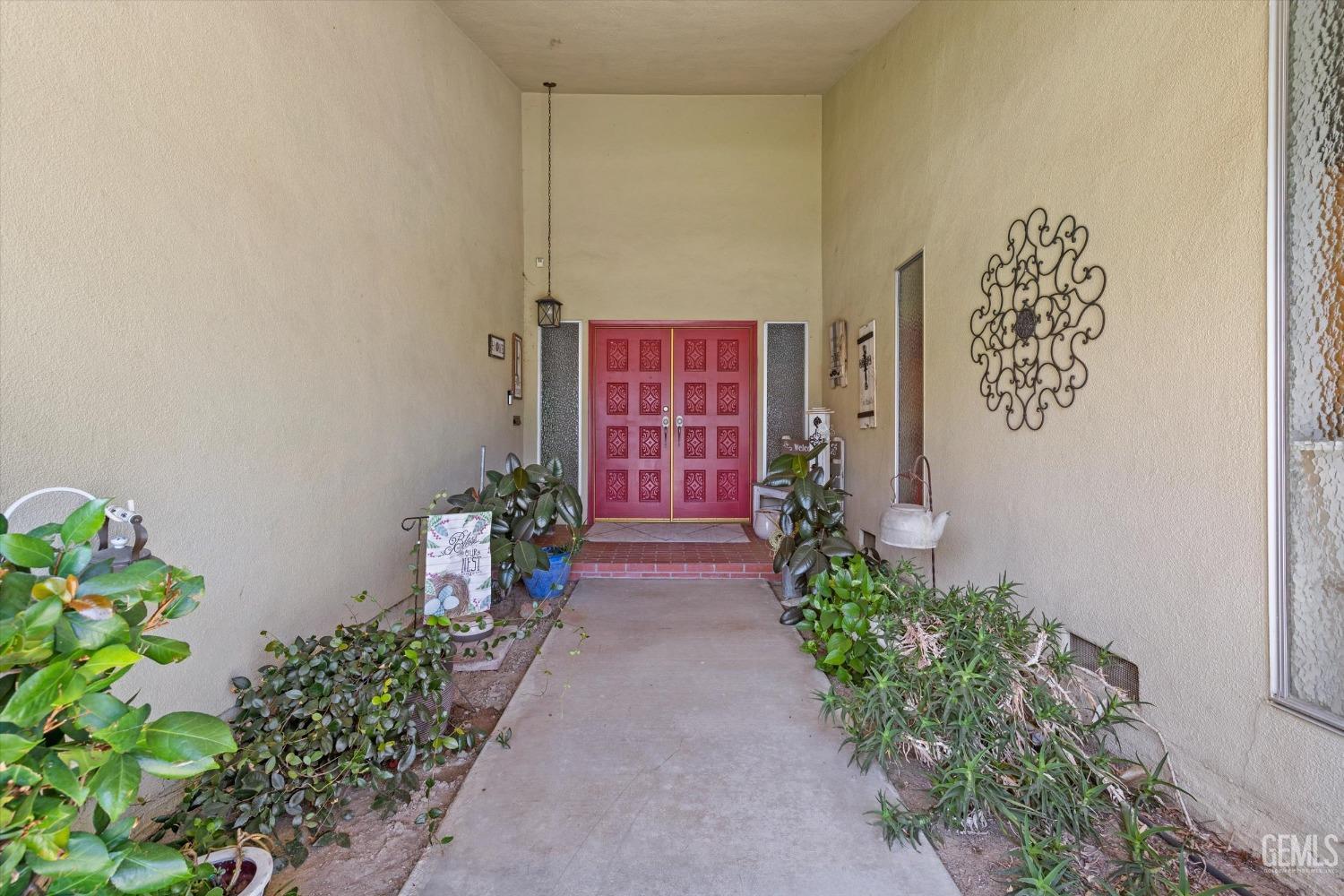 Undisclosed Address Bakersfield, CA 93309 - Photo 4 of 34 a view of front door of house