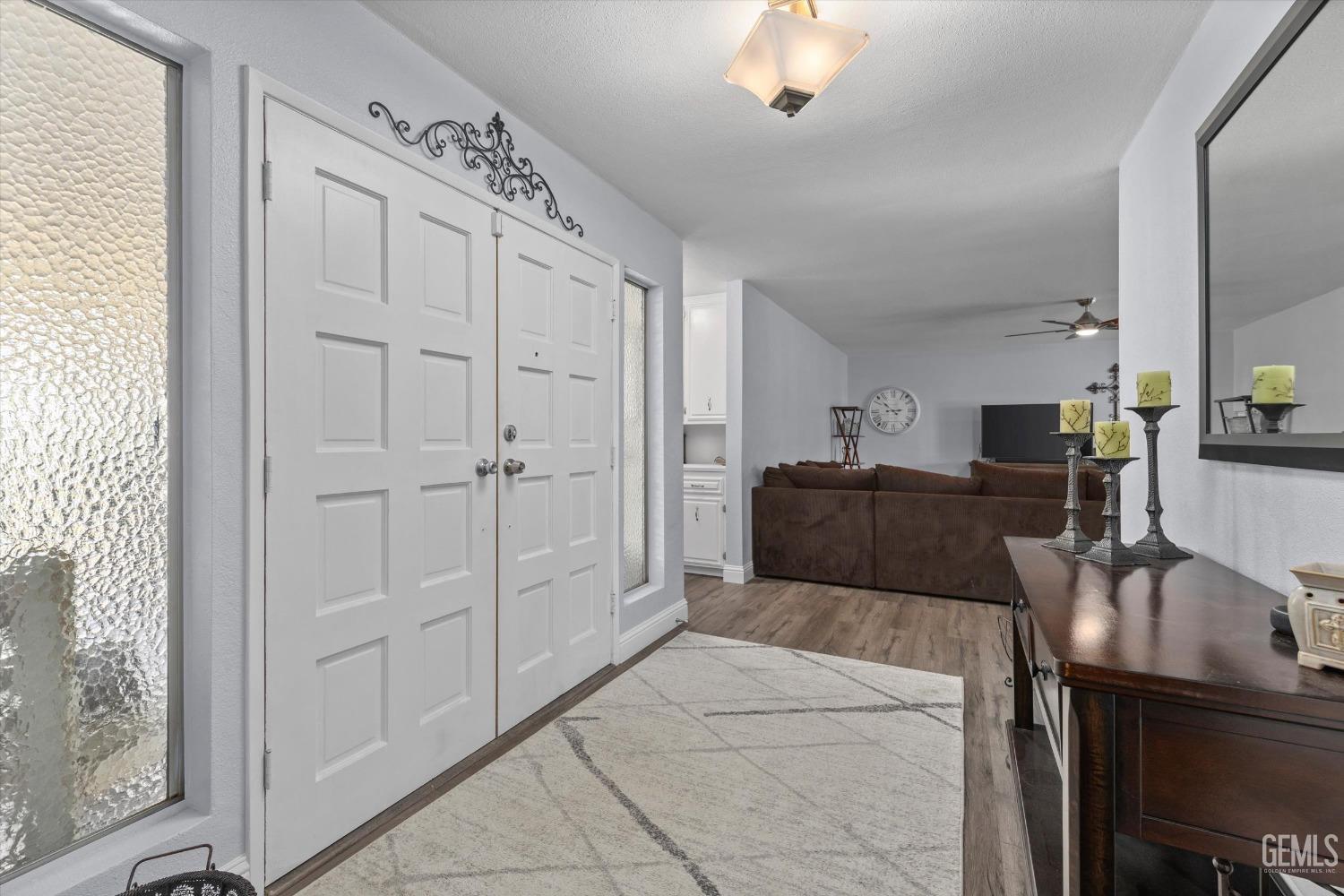 Undisclosed Address Bakersfield, CA 93309 - Photo 6 of 34 a living room with furniture and a chandelier