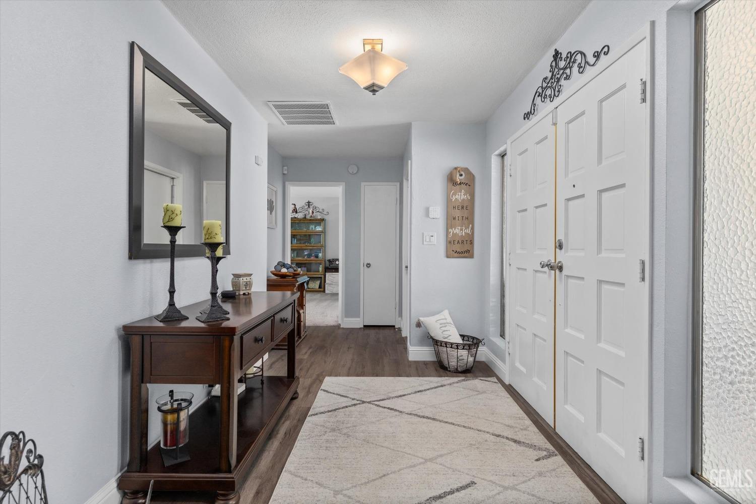 Undisclosed Address Bakersfield, CA 93309 - Photo 7 of 34 a view of a hallway with workspace to rooms