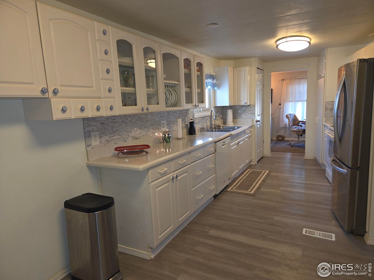 15296 County Road 39 Sterling, CO 80751 - Photo 15 of 26 a kitchen with stainless steel appliances granite countertop a sink refrigerator and cabinets