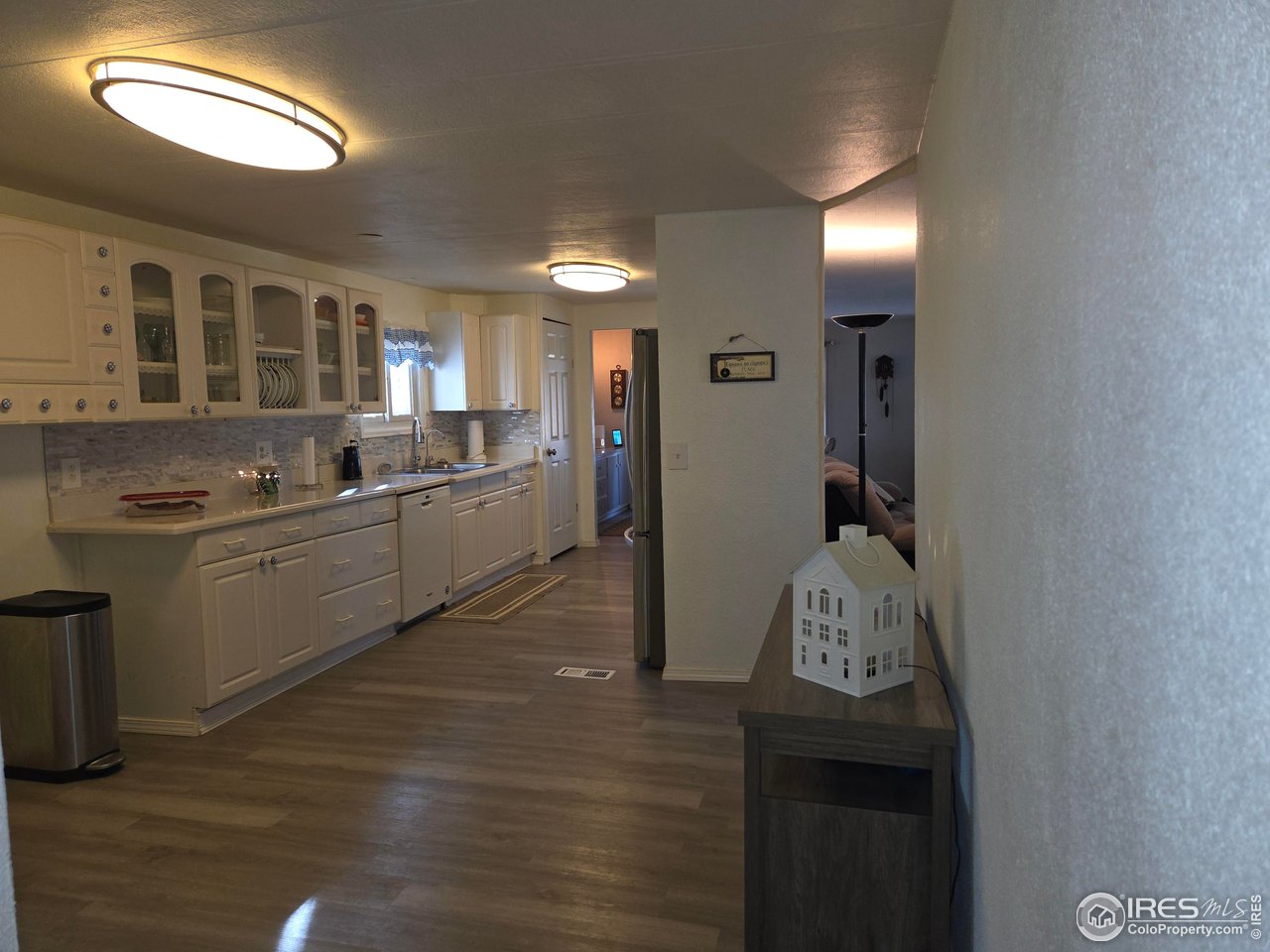 15296 County Road 39 Sterling, CO 80751 - Photo 16 of 26 a kitchen with granite countertop a sink and cabinets