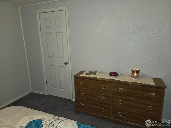 a room with a dresser