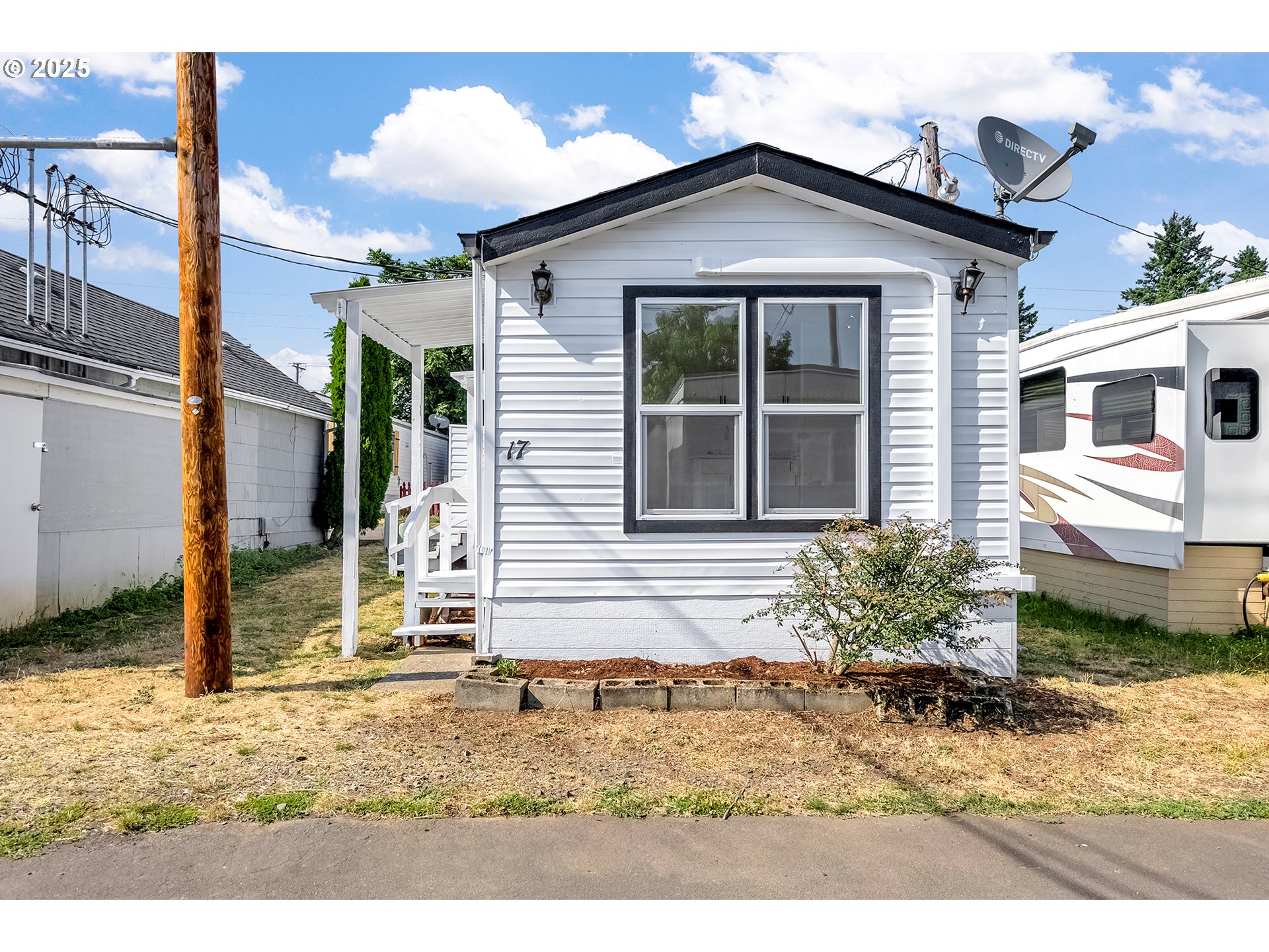 12726 Southeast Division Street, Unit 17 Portland, OR 97236 - Photo 1 of 26 a view of a house with a yard