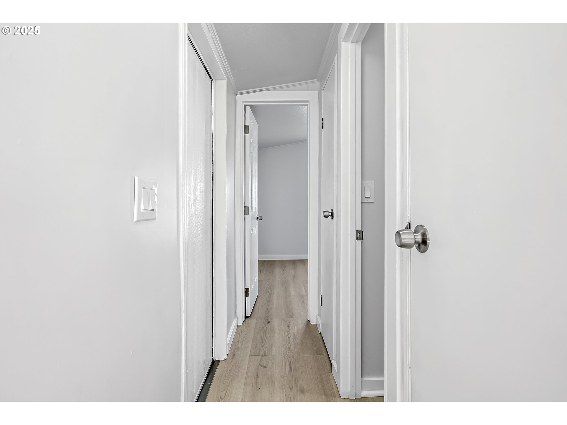 12726 Southeast Division Street, Unit 17 Portland, OR 97236 - Photo 22 of 26 a view of a bathroom from a hallway