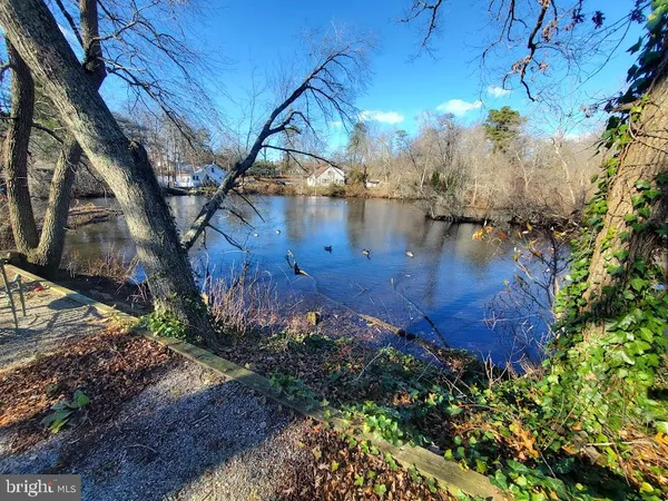 a view of yard with wooden fence