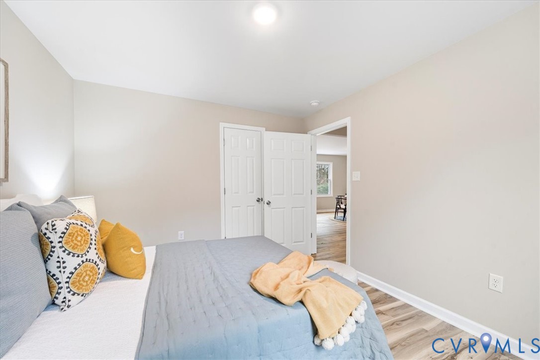 1989 Cox Road Blackstone, VA 23824 - Photo 25 of 44 Bedroom with light wood finished floors and basebo