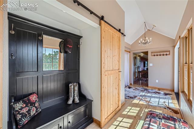 903 High Road Manitou Springs, CO 80829 - Photo 6 of 49 Hall tree anchors the 2 custom closets behind the barn doors.