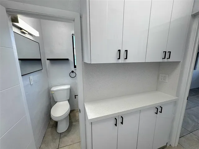 a kitchen with appliances cabinets and a sink