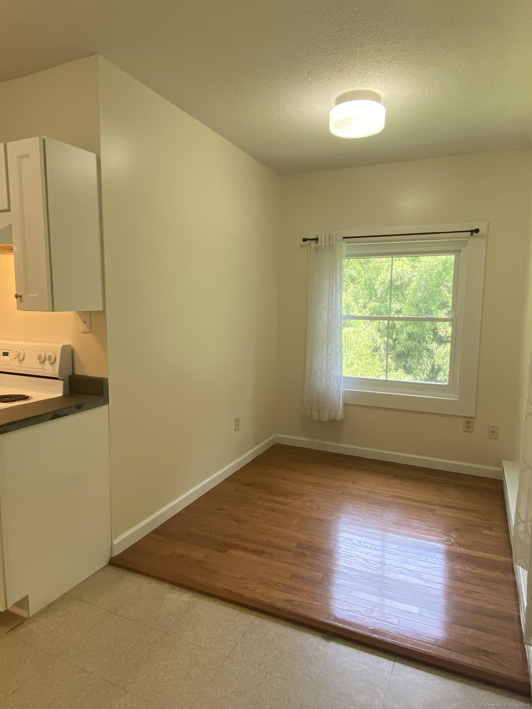 51 Pearl Street Guilford, CT 06437 - Photo 8 of 12 an empty room with a window