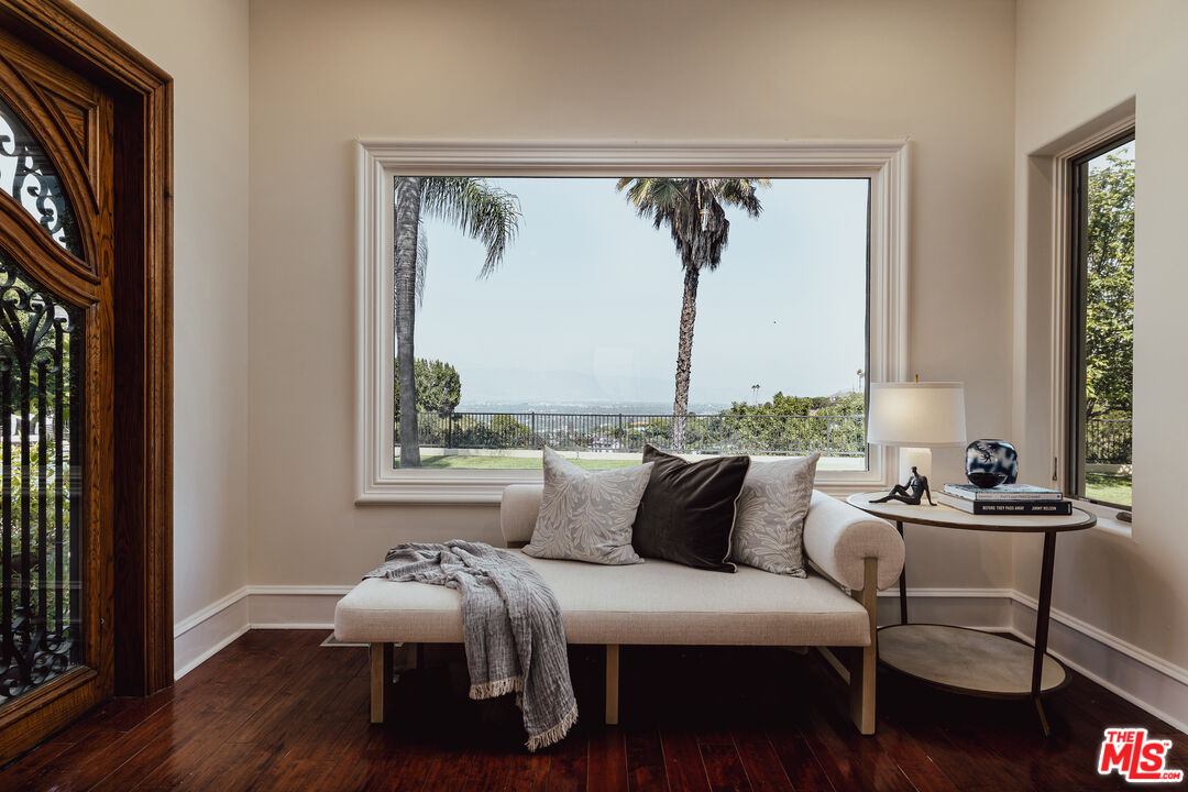 3364 Clerendon Road Beverly Hills, CA 90210 - Photo 12 of 33 a bedroom with furniture and a window