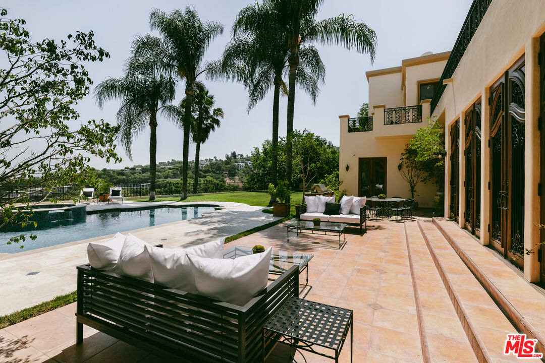 3364 Clerendon Road Beverly Hills, CA 90210 - Photo 13 of 33 a view of swimming pool with chairs