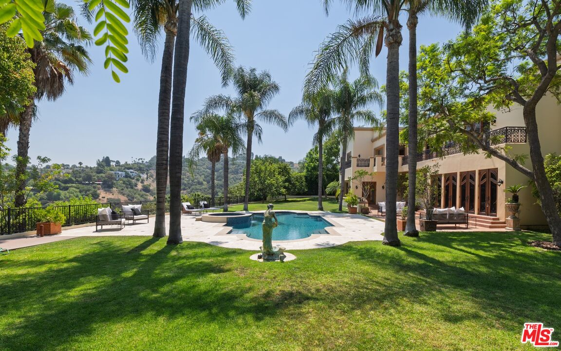 3364 Clerendon Road Beverly Hills, CA 90210 - Photo 15 of 33 a view of a house with a backyard and a patio