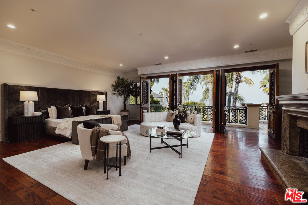 3364 Clerendon Road Beverly Hills, CA 90210 - Photo 17 of 33 a living room with fireplace furniture and a wooden floor