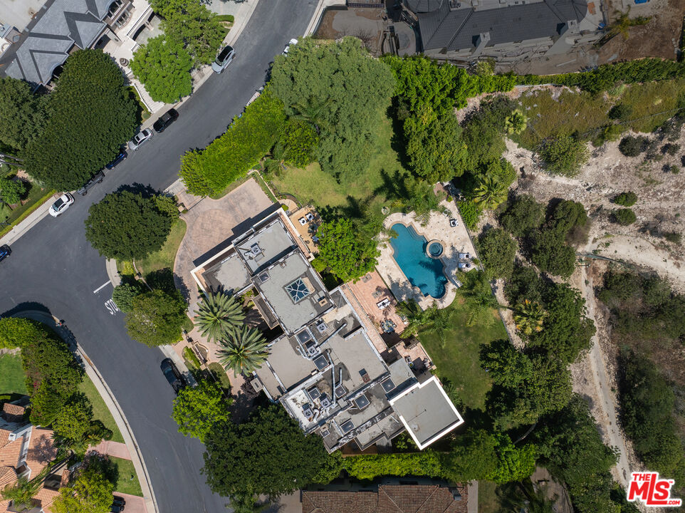 3364 Clerendon Road Beverly Hills, CA 90210 - Photo 33 of 33 an aerial view of a house with a yard and garden