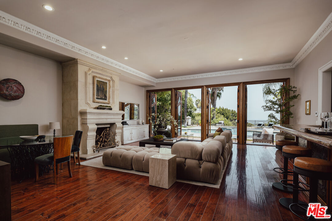 3364 Clerendon Road Beverly Hills, CA 90210 - Photo 5 of 33 a living room with furniture fireplace and flat screen tv