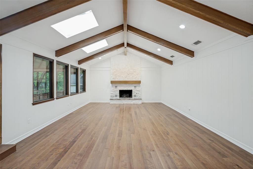 1607 North Main Street Euless, TX 76039 - Photo 25 of 39 a view of an empty room with wooden floor and a window