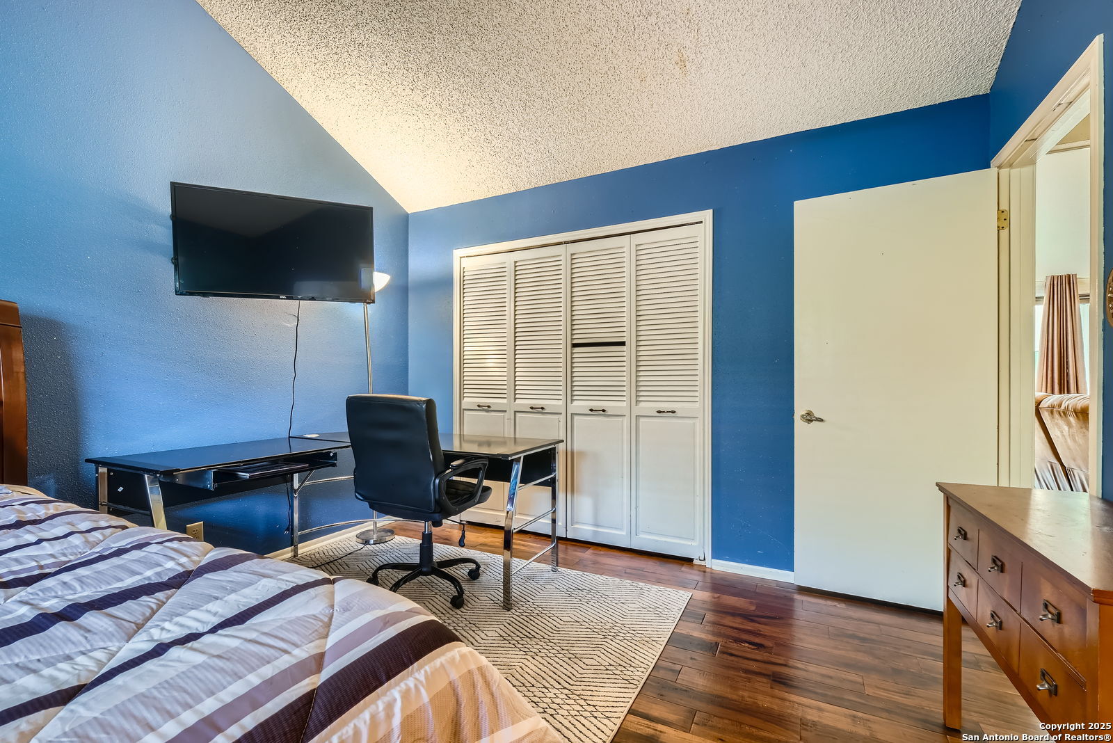 13215 Hunters Spring San Antonio, TX 78230 - Photo 19 of 29 a workspace with furniture and a flat screen tv