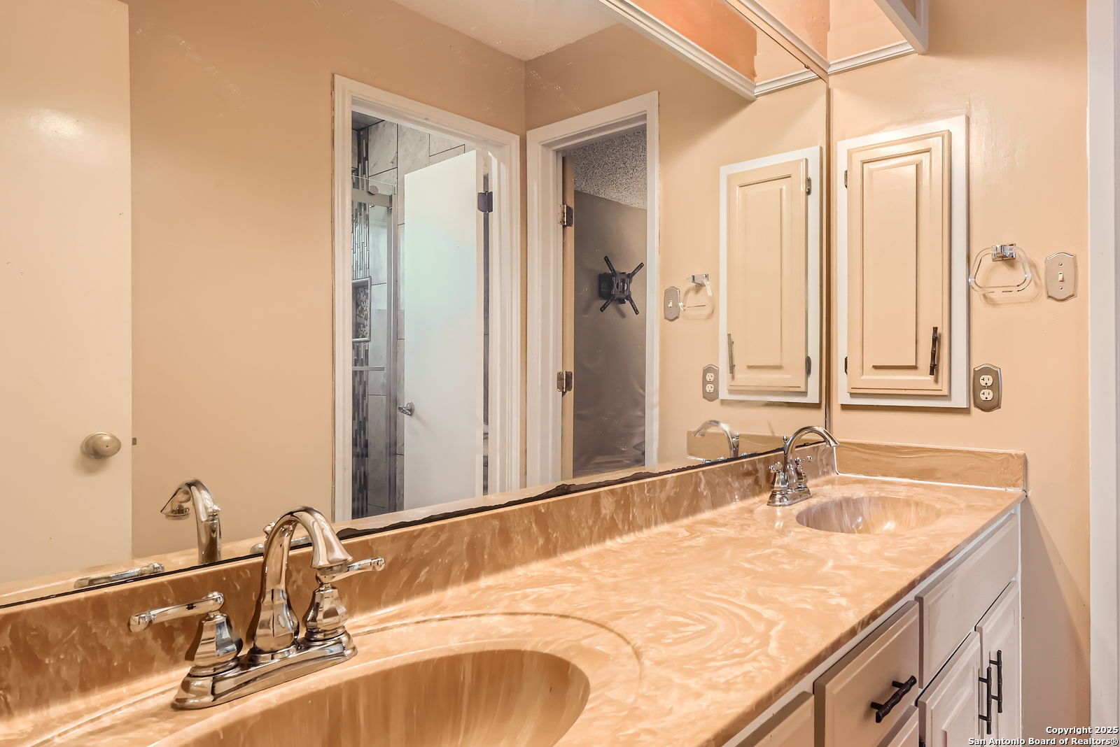 13215 Hunters Spring San Antonio, TX 78230 - Photo 24 of 29 a bathroom with a granite countertop sink and a mirror