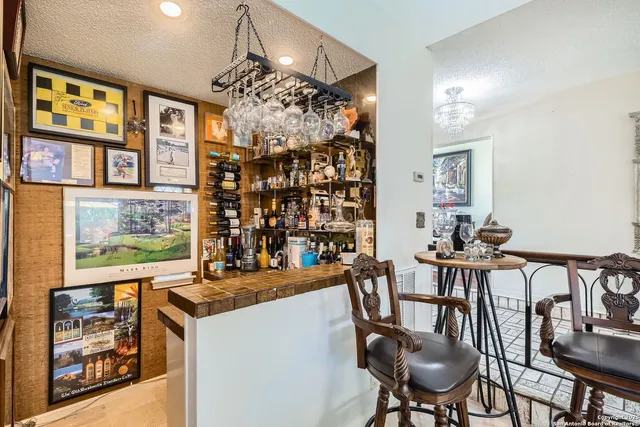 a backyard of a house with yard and outdoor seating